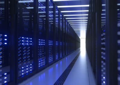 Data center corridor with illuminated server racks, illustrating a deep neural networks project